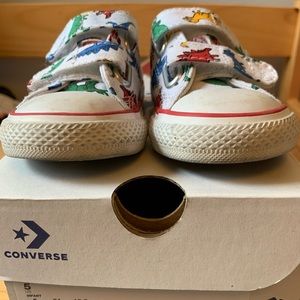 Used dinosaur converse.  Toddler size 5